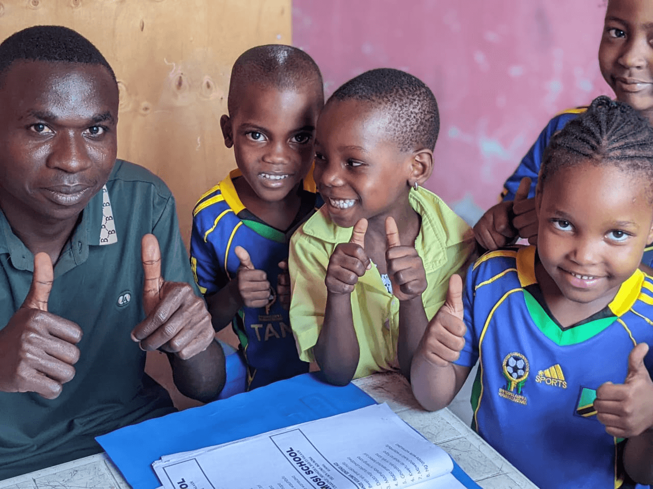 Students smiling with their teacher